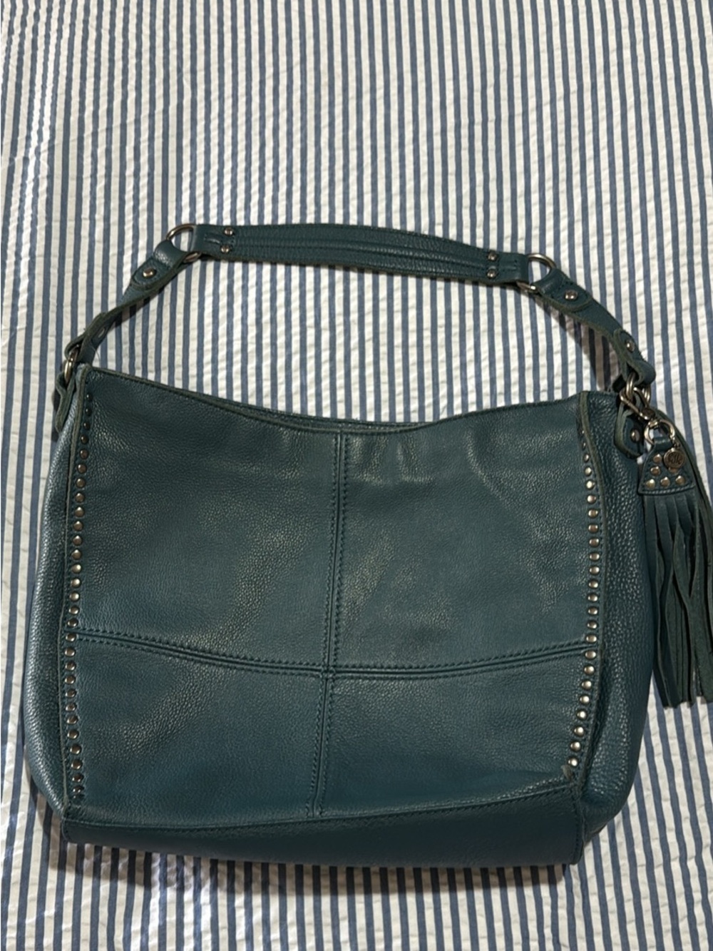 The Sak Teal Pebbled Leather Shoulder Hobo with Tassel